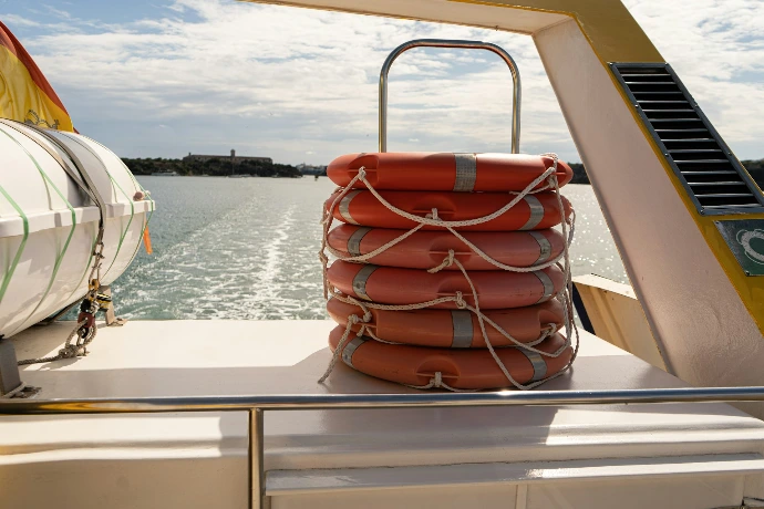 Stack of orange life preservers on a boat